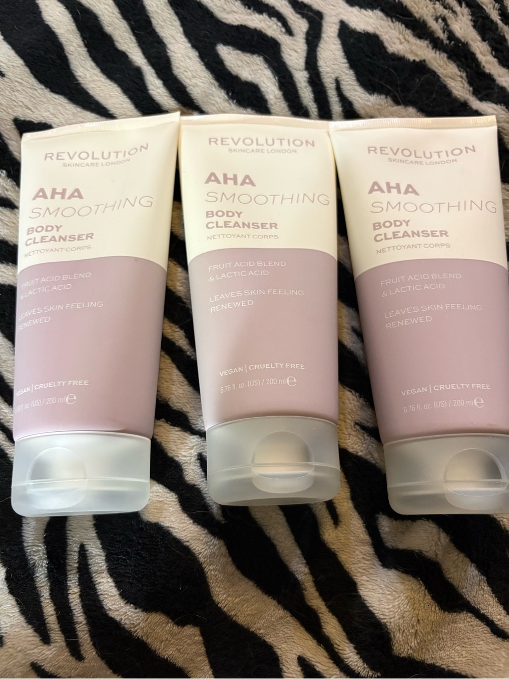 Revolution AHA Smoothing Body Cleanser - Pale Pink & Cream Tubes